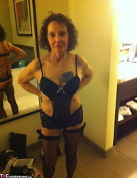 Curly haired mature woman likes sending her younger partner provocative photos