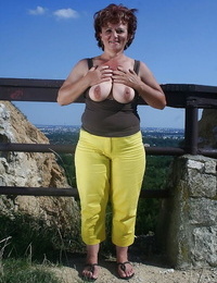 Naughty granny uncovering her fatty body with flabby boobs outdoor